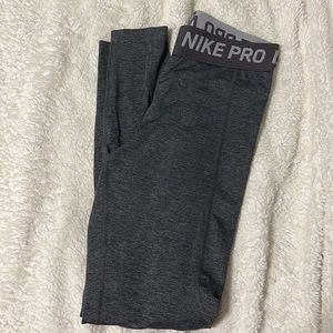 Nike leggings, grey, cute waist band, no pockets, size small.
